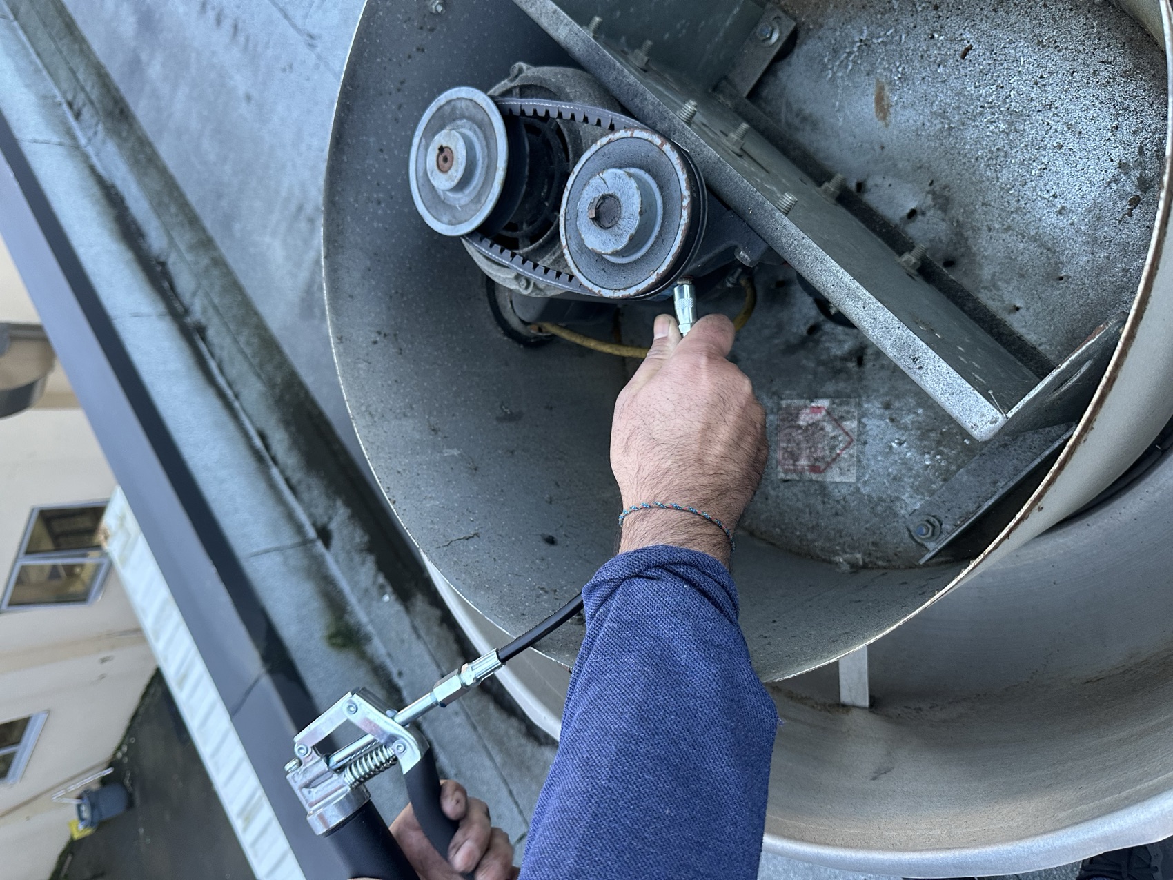 Inspector servicing a freshly cleaned fan