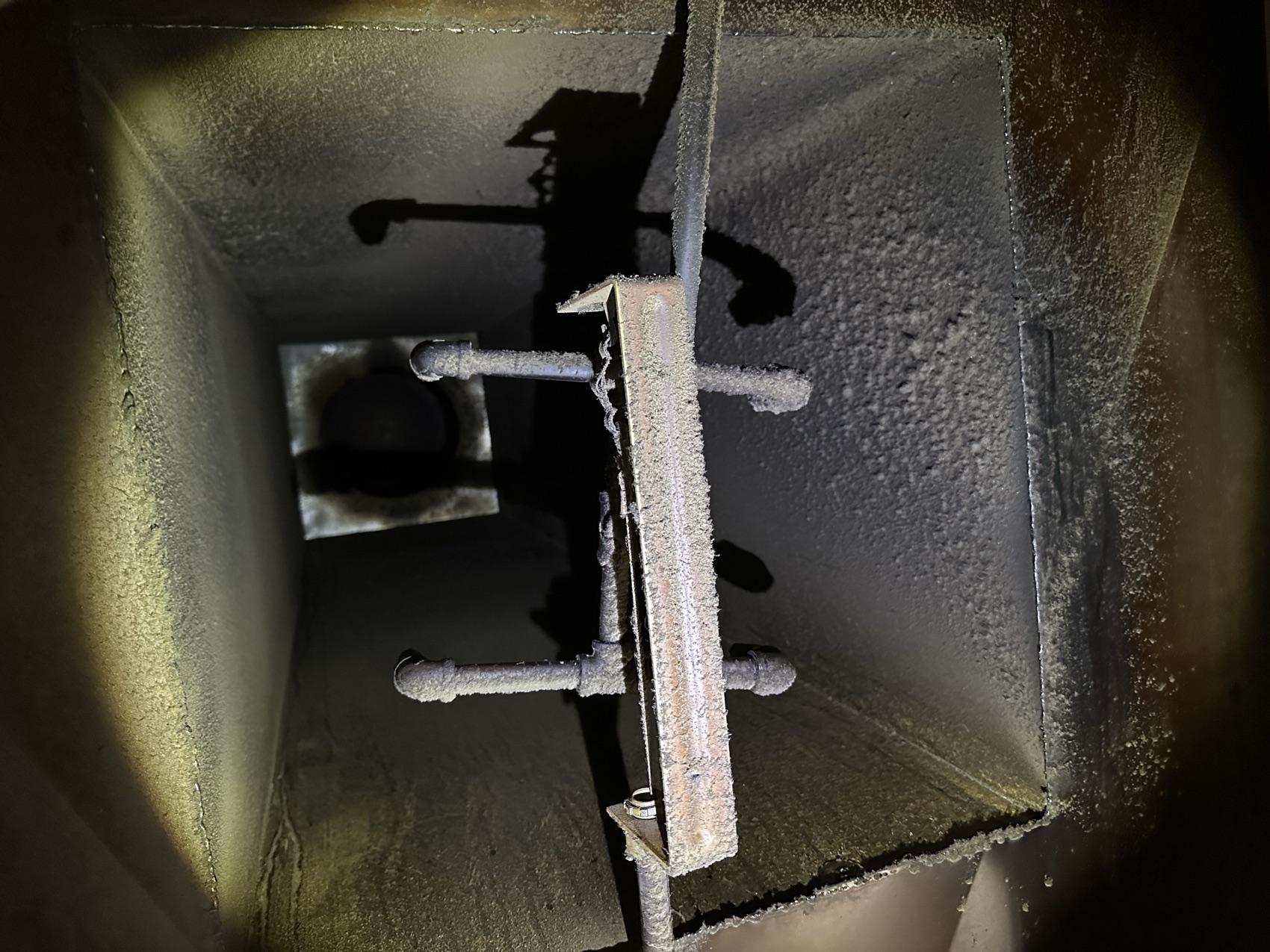 Grease around duct access cap before cleaning