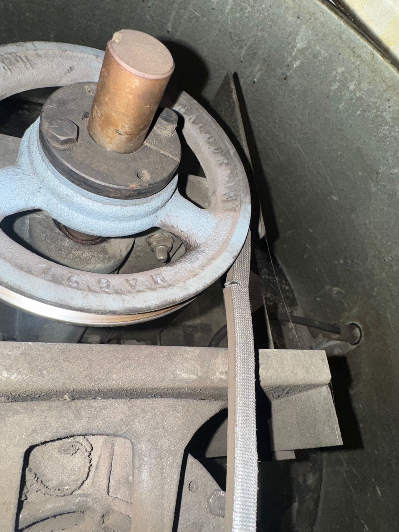 Caked bearing and V-belt before cleaning