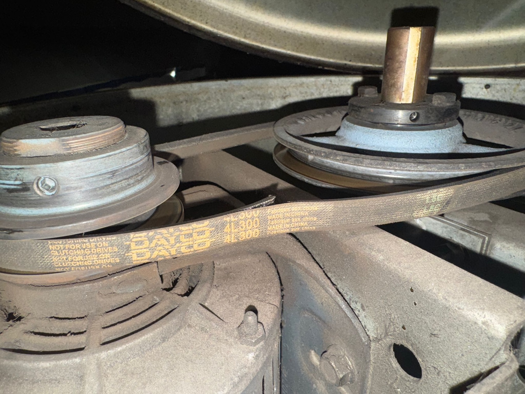 Grease-coated drive belt before cleaning