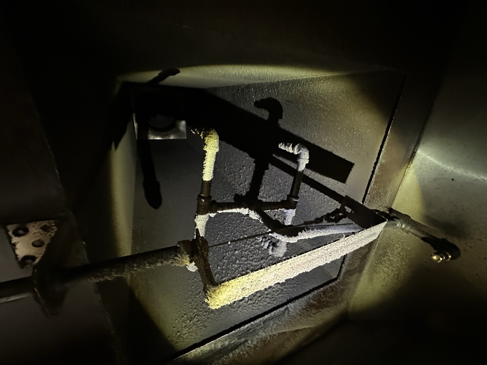 Grease-caked access door before cleaning